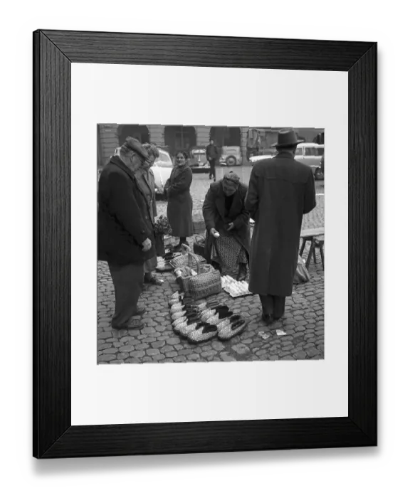 Framed Print : Woman sells different things (shoes)