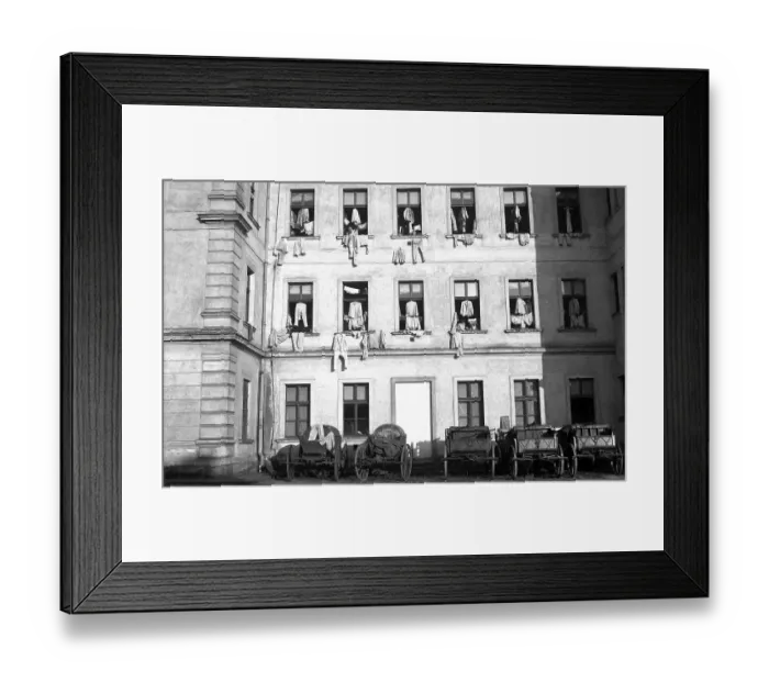 Framed Print : Facade of houses, on which clothes were hung for drying on window crosses Framed Print : Facade of houses, on which clothes were hung for drying on window crosses