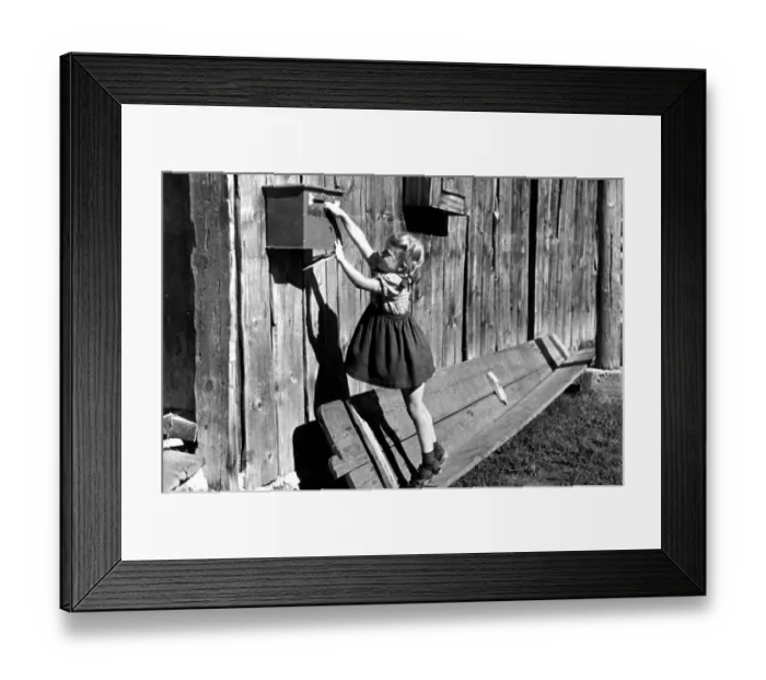 Framed Print : Girl trying to reach mailbox, ca Framed Print : Girl trying to reach mailbox, ca