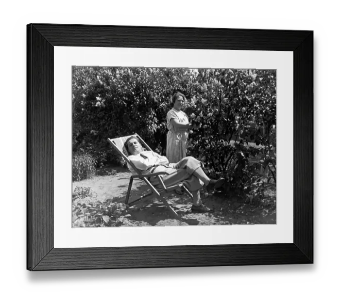 Framed Print : Garden, relaxing in deck chair, ca Framed Print : Garden, relaxing in deck chair, ca