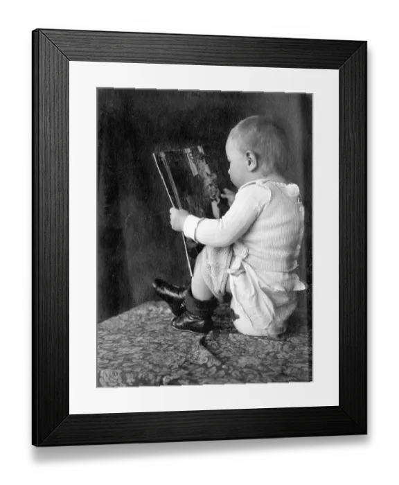 Framed Print : Baby reads magazine and sits on the pot ca Framed Print : Baby reads magazine and sits on the pot ca