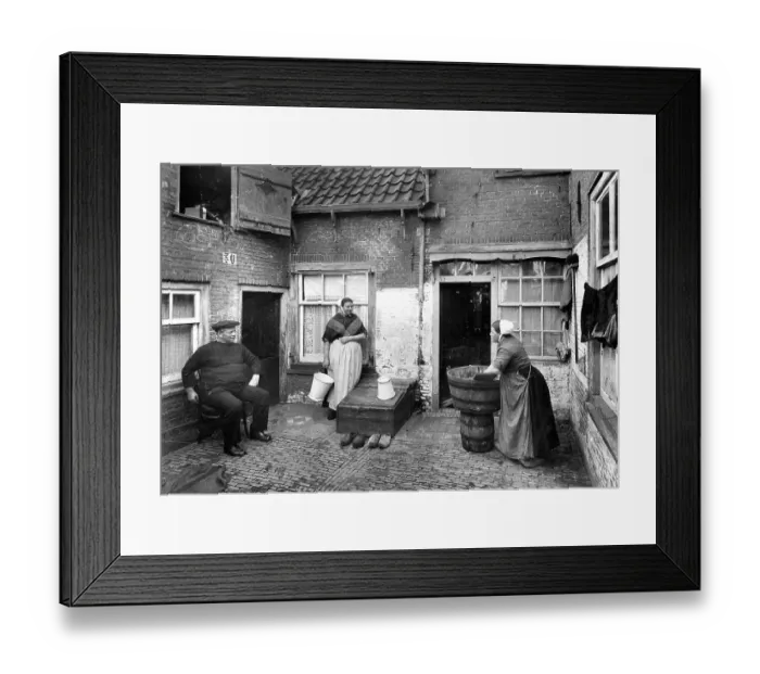 Framed Print : Washing laundry in the courtyard ca
