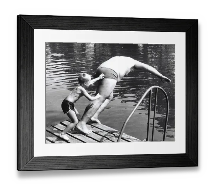 Framed Print : Boy throws man in the water ca