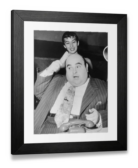 Framed Print : Thick man with bald head combs, ca