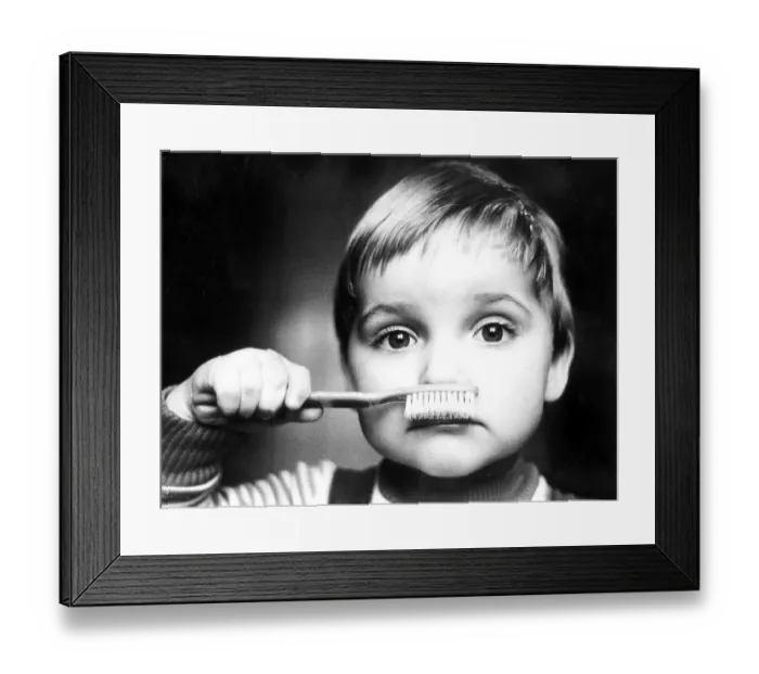 Framed Print : Child with toothbrush, ca. 1980s Framed Print : Child with toothbrush, ca. 1980s