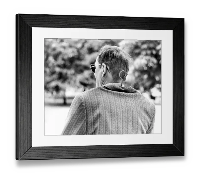 Framed Print : Man with hanger in jacket, ca. 1980s