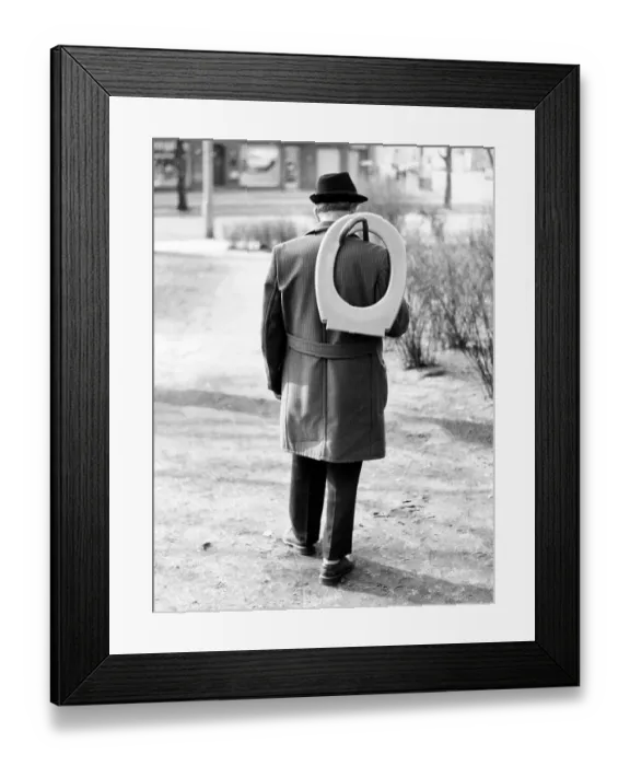 Framed Print : Man with toilet seat, ca. 1980s