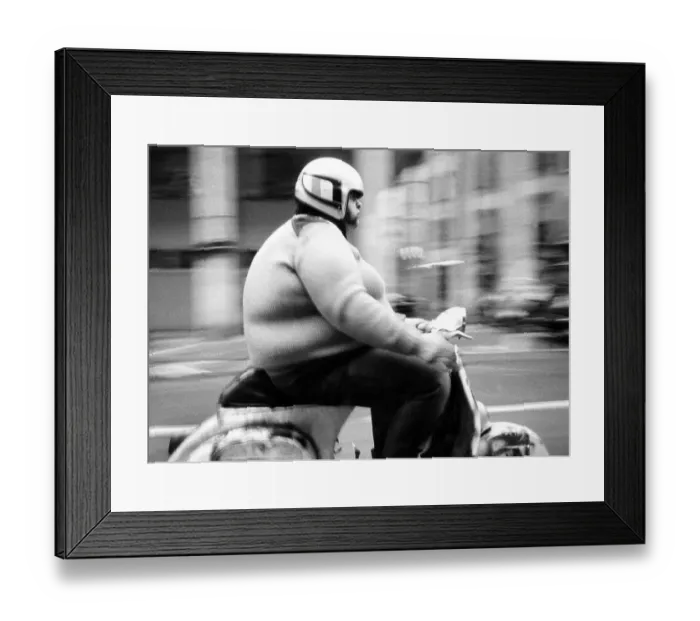 Framed Print : Thick man on a scooter, between 50s and 60s Framed Print : Thick man on a scooter, between 50s and 60s