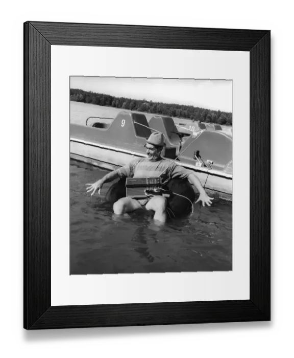 Framed Print : Man with radio in the water, ca