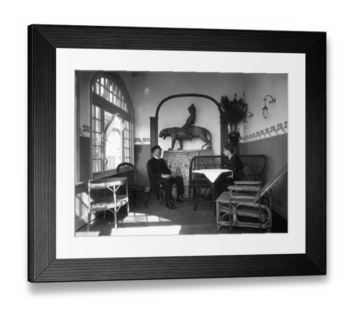 Framed Print : Couple sits in winter garden and converses