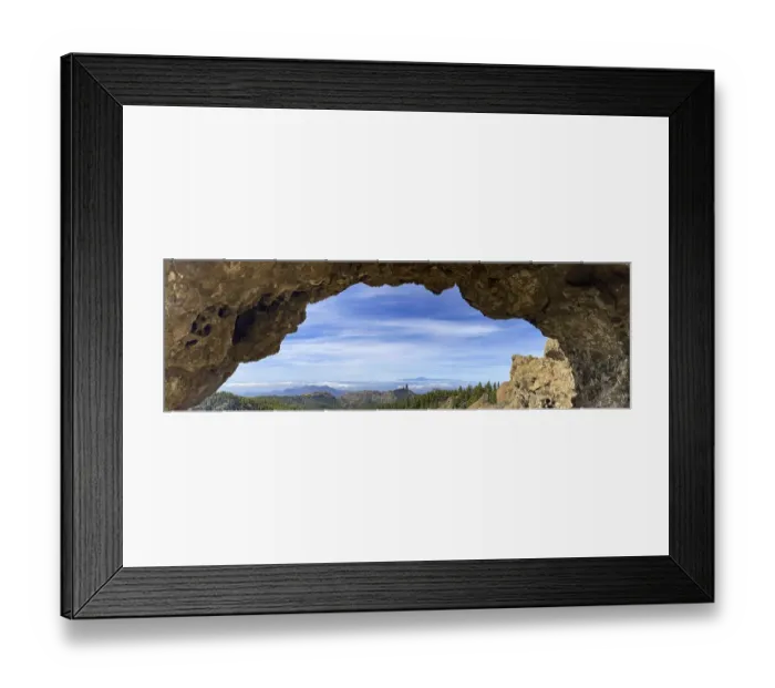 Framed Print : View through a rock arch to Roque Nublo and the Teide mountain peak on the neighbouring island of Tenerife