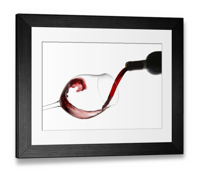 Framed Print : Red wine being poured into a red wine glass Framed Print : Red wine being poured into a red wine glass