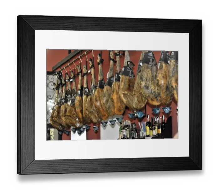 Framed Print : Cordoba, row of Iberian hams hanging in a Spanish restaurant