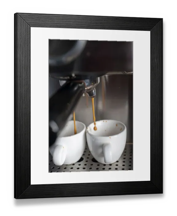 Framed Print : Italian espresso coffe making with professional machine macro