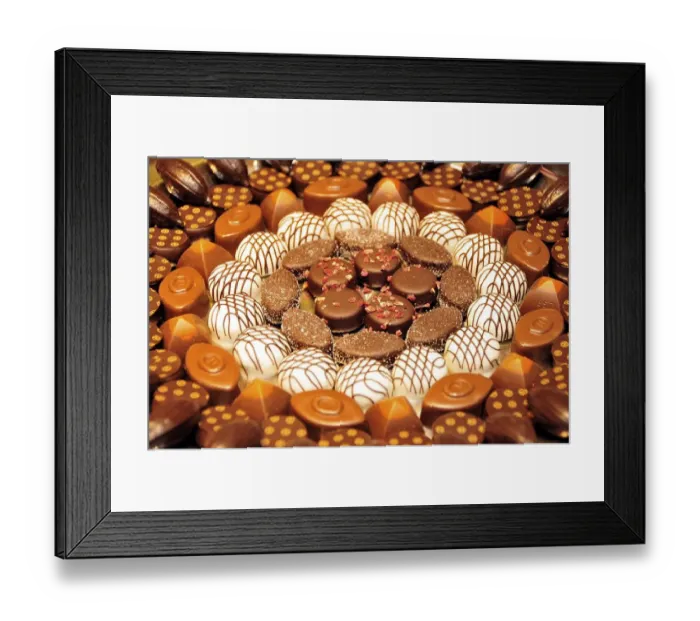 Framed Print : Typical Belgian chocolates in a delicatessen in a shopping mall Framed Print : Typical Belgian chocolates in a delicatessen in a shopping mall