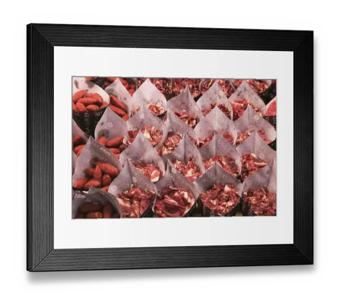 Framed Print : Cuts of ham and small sausages packed for sale