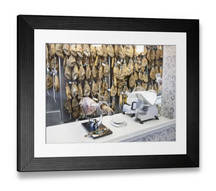 Framed Print : Close up display of cured hams inside a specialist shop in Barrio Macarena