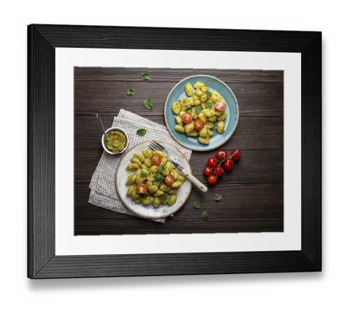 Framed Print : Gnocchi in plates with green pesto sauce