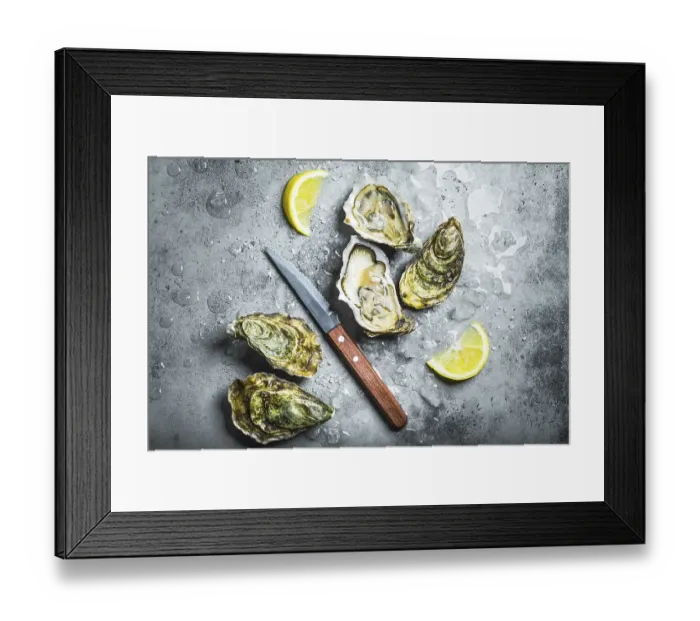 Framed Print : Fresh oysters on ice, knife, lemon wedges