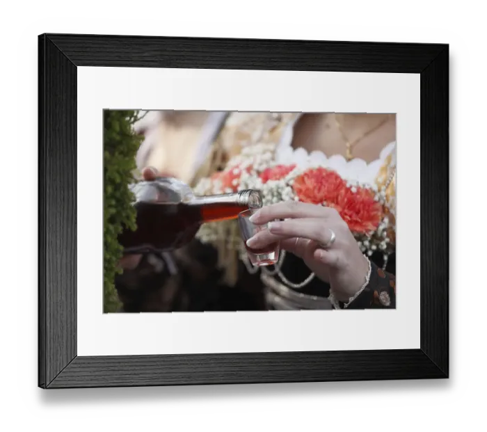 Framed Print : Woman pouring a shot of brandy Framed Print : Woman pouring a shot of brandy