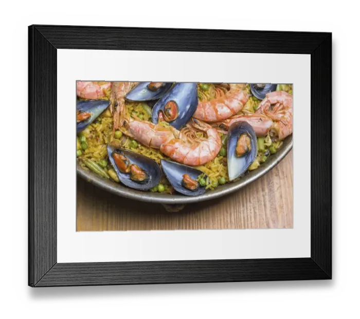 Framed Print : Freshly cooked seafood paella with vibrant colors served in a rustic pan