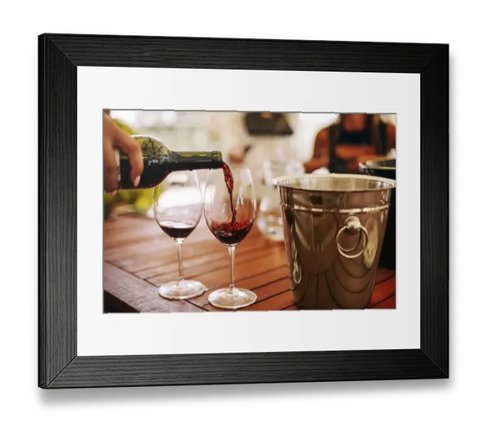Framed Print : Glasses with different types of wine and human hands holding wine glasses in the background Framed Print : Glasses with different types of wine and human hands holding wine glasses in the background