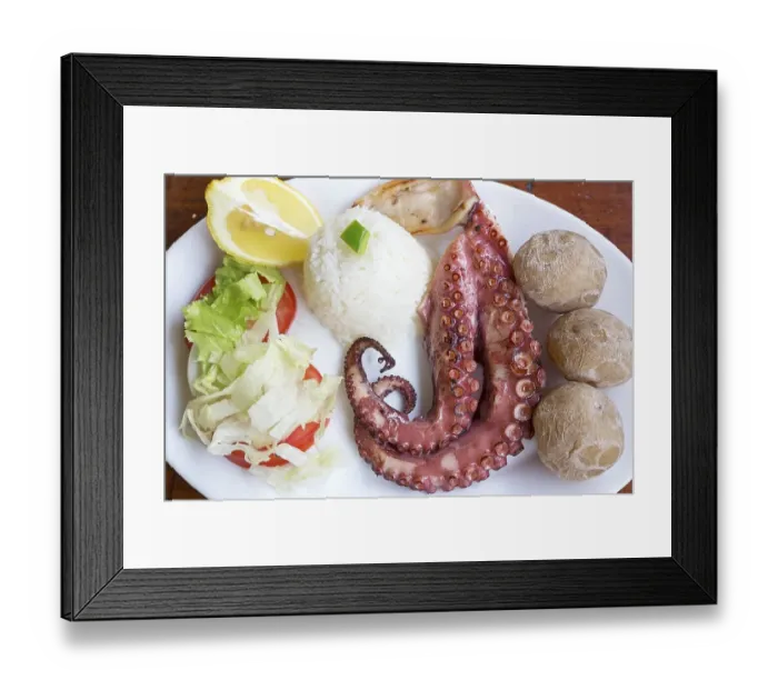 Framed Print : Grilled octopus with side dishes on a plate