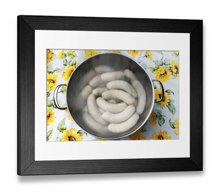 Framed Print : White sausages in a pot of hot water