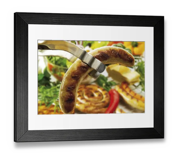 Framed Print : Barbecue tongs with fried sausage