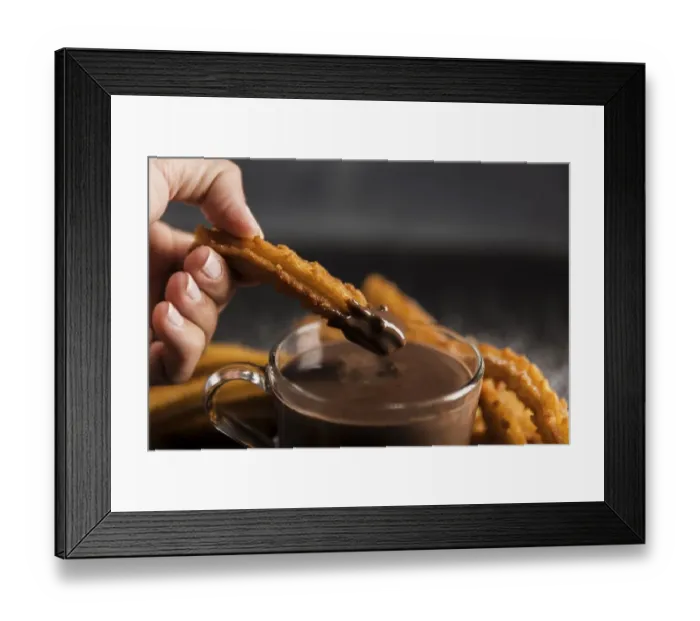 Framed Print : Hand dipping fried churros chocolate Framed Print : Hand dipping fried churros chocolate