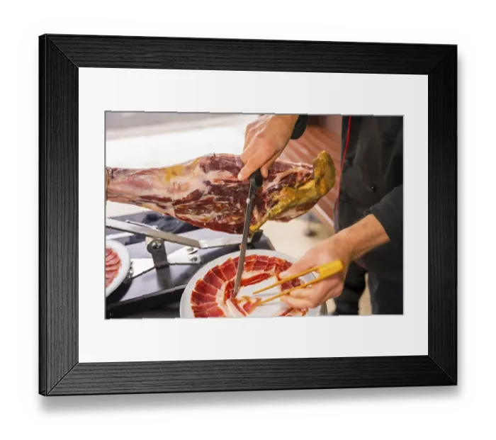 Framed Print : Ham cutter man. Service of a person cutting a piece of ham