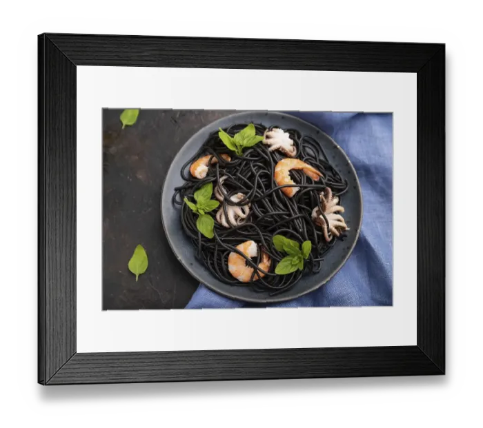 Framed Print : Black cuttlefish ink pasta with shrimps or prawns and small octopuses on black concrete background and blue textile Framed Print : Black cuttlefish ink pasta with shrimps or prawns and small octopuses on black concrete background and blue textile