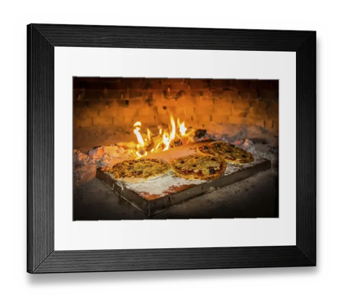 Framed Print : Pizza is baked in a pizza oven Framed Print : Pizza is baked in a pizza oven