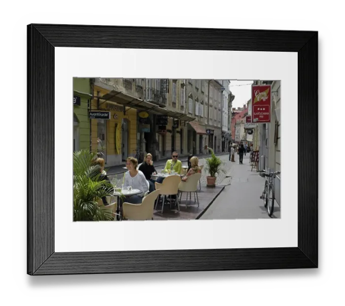 Framed Print : Restaurant guests in the old part of the town Framed Print : Restaurant guests in the old part of the town