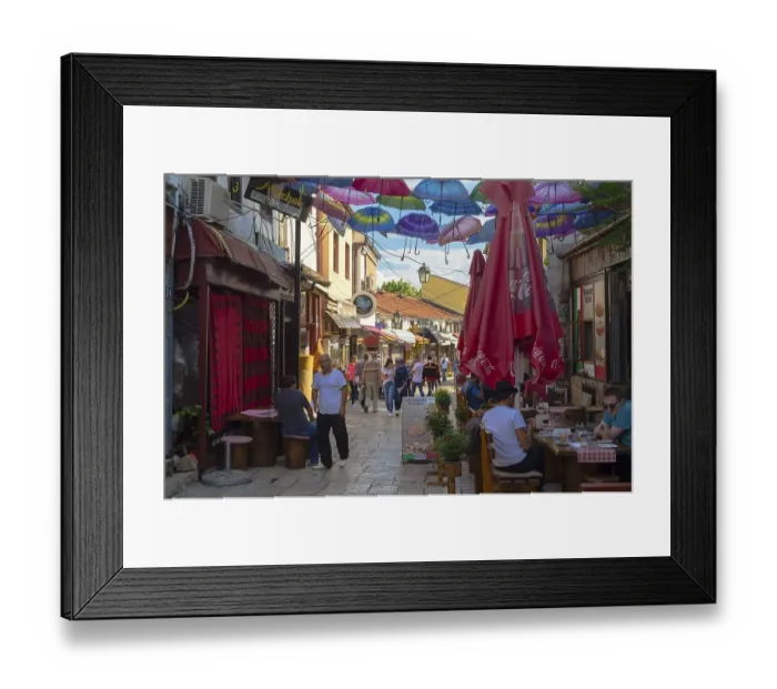 Framed Print : Colorful umbrellas hanging in a street Framed Print : Colorful umbrellas hanging in a street