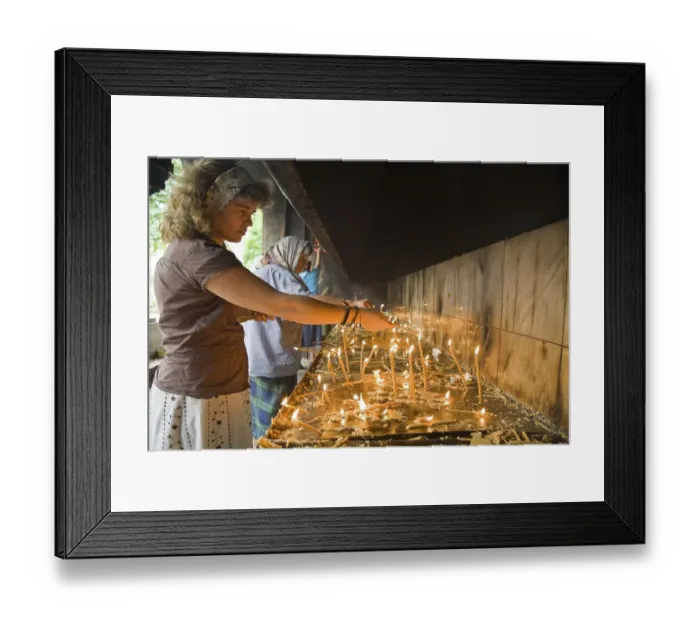 Framed Print : Believers light candles in front of the Romanian-orthodox Catedrala PatriarhalA patriarchal church to mourn the death