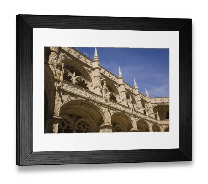 Framed Print : Old architectural building with arches and carved decorative sculptures in the inner courtyard at Jeronimos Monastery