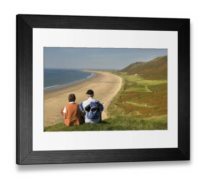 Framed Print : Two hikers looking onto the beach Framed Print : Two hikers looking onto the beach