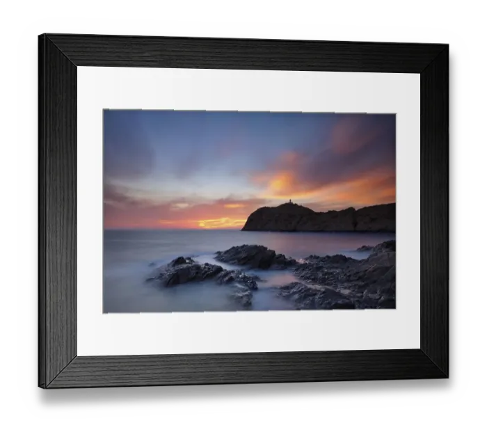 Framed Print : L'lle-Rousse Peninsula with Da le Pietra Lighthouse at sunset