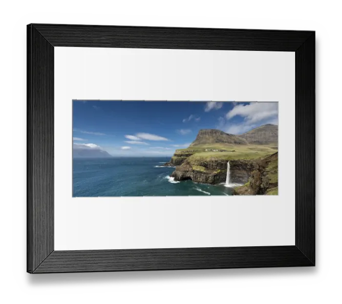 Framed Print : Cliffs with a waterfall near a village Framed Print : Cliffs with a waterfall near a village