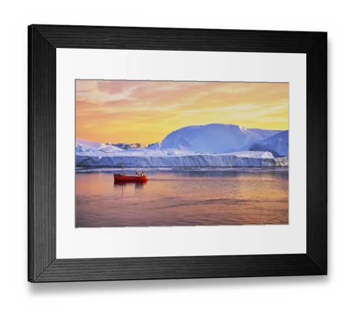 Framed Print : Red boat with tourists in front of icebergs in evening light Framed Print : Red boat with tourists in front of icebergs in evening light