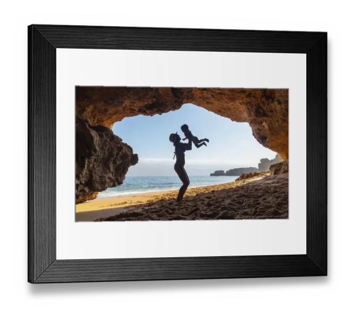 Framed Print : Mother with son in the cave on the beach in the Algarve Framed Print : Mother with son in the cave on the beach in the Algarve