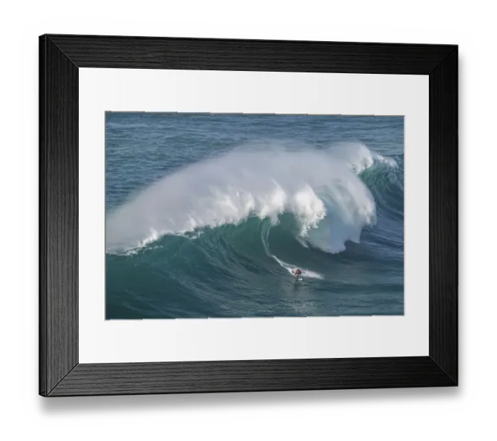 Framed Print : A surfer rides a crashing wave Framed Print : A surfer rides a crashing wave