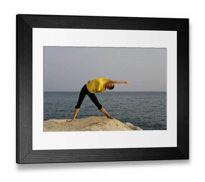 Framed Print : Woman in a yoga position, Trikonasana