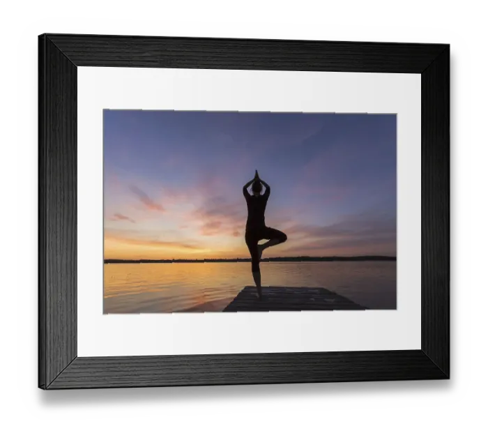 Framed Print : Woman practicing standing posture Vrikshasana Framed Print : Woman practicing standing posture Vrikshasana