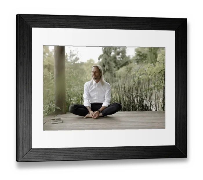Framed Print : Businessman in white shirt sits on wooden jetty and writes in a book