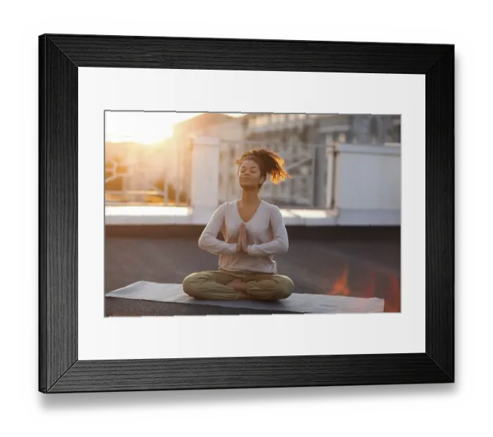 Framed Print : Cropped photo of woman sitting in lotus pose on mat and practicing yoga