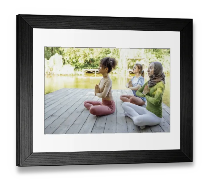 Framed Print : Group of teenages is engaged in fitness on pier by the lake or river