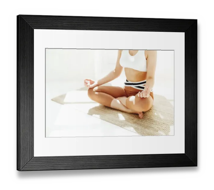 Framed Print : Back view of unrecognizable female in sportswear sitting with crossed legs and mudra hands on mat