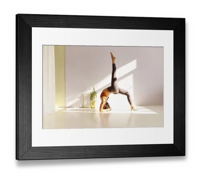 Framed Print : Side view of calm female in sportswear practicing yoga in Firefly pose while balancing on arms on mat and looking away